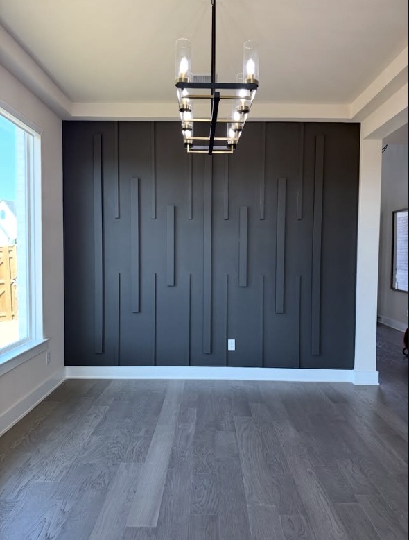 Charcoal vertical batten accent wall in dining room