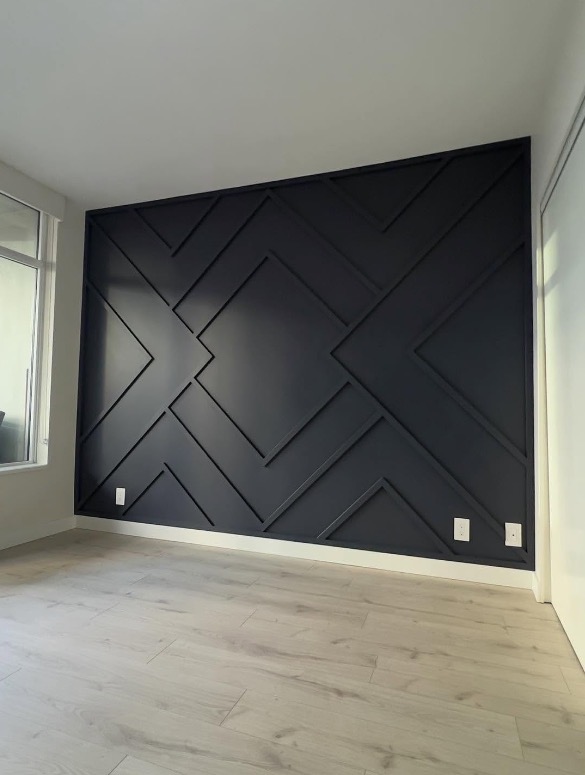 Black geometric diamond pattern accent wall